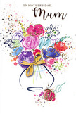 This Mother's Day card features a joyful, free-flowing bouquet, painted in vibrant watercolours that capture the spirit of gifting fresh flowers across Hemel Hempstead. At its core, rich cerise and deep pink blossoms open wide, their rounded shapes evoking roses caught at the perfect moment of bloom. The petals are suggested with soft, broad strokes, edged and deepened with touches of indigo that add dimension without sacrificing the dreamy quality of the illustration. Cooler blue and lavender tones weave around the warmer flowers, with occasional swirls of apricot, peach, and bright chartreuse bringing light and lift, much like a well-balanced hand-tied bouquet prepared for Mother's Day. Threads of metallic gold pick out selected petals and stems, offering a gentle sparkle reminiscent of late-afternoon sun over the rooftops near the Old Town. The flowers rise from a stylised vase with smooth, curving sides, painted in pale, translucent shades; at its neck, a small golden bow is neatly illustrated, the loops suggesting the careful, loving touch that goes into finishing a gift. The white background provides breathing space while still feeling festive, dotted with whimsical paint splatters, delicate hearts, and tiny flecks of colour that seem to float like petals caught in a soft breeze. The overall impression is one of warmth, gratitude, and celebration-a visual hug for Mum that pairs beautifully with real blooms delivered to homes in areas like Leverstock Green, Bennetts End, or Grove Hill, ensuring that both card and flowers together tell a story of love and appreciation.